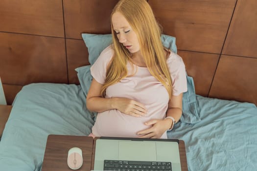 Weary pregnant woman, tired of working from home, navigates the challenges of balancing professional tasks with pregnancy demands.