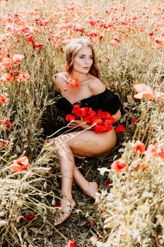 Woman poppies field. portrait of a happy woman with long hair in a poppy field and enjoying the beauty of nature in a warm summer day