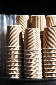 stacks of stacked clean craft cups for hot drinks .