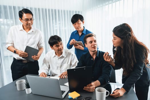 Group of diverse office worker employee working together on strategic business marketing planning in corporate office room. Positive teamwork in business workplace concept. Prudent