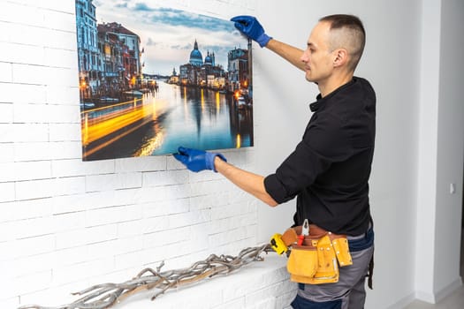 Photo canvas print. A man holding a photography with gallery wrap. High quality photo