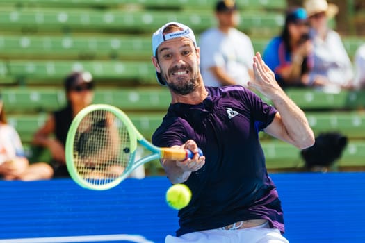 MELBOURNE, AUSTRALIA - JANUARY 12: Richard Gasquet of France plays Marc Polmans of Australia during day three of the 2024 Kooyong Classic at Kooyong on January 12, 2024 in Melbourne, Australia.