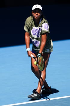 MELBOURNE, AUSTRALIA - JANUARY 12: Naomi Osaka of Japan practices with Ons Jabeur of Tunisia ahead of the 2024 Australian Open at Melbourne Park on January 12, 2024 in Melbourne, Australia.