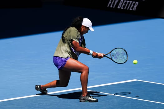 MELBOURNE, AUSTRALIA - JANUARY 12: Naomi Osaka of Japan practices with Ons Jabeur of Tunisia ahead of the 2024 Australian Open at Melbourne Park on January 12, 2024 in Melbourne, Australia.