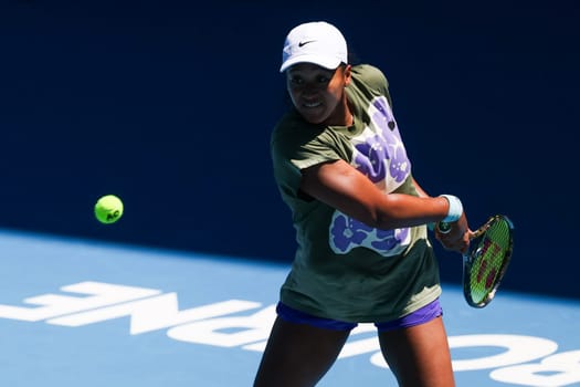 MELBOURNE, AUSTRALIA - JANUARY 12: Naomi Osaka of Japan practices with Ons Jabeur of Tunisia ahead of the 2024 Australian Open at Melbourne Park on January 12, 2024 in Melbourne, Australia.