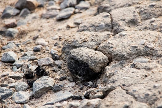 Stones in the sand close up, backgroun or texture