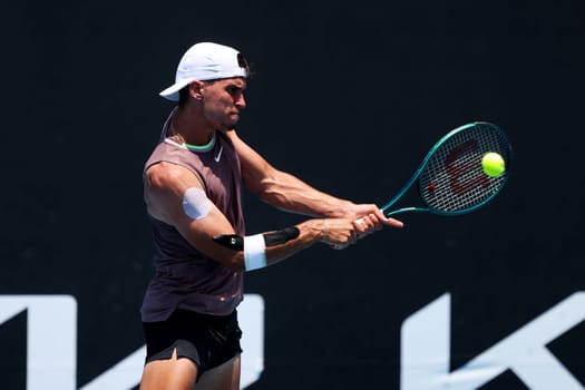 MELBOURNE, AUSTRALIA - JANUARY 12: Dino Prižmić of Croatia on his way to beating Aziz Dougaz of Tunisia in qualifying Atmosphere ahead of the 2024 Australian Open at Melbourne Park on January 12, 2024 in Melbourne, Australia.