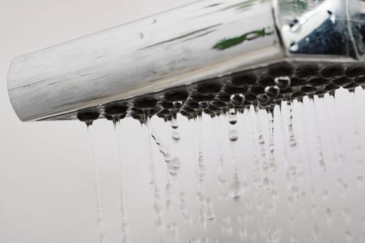 Drops of water from a shower head close up, macro photo