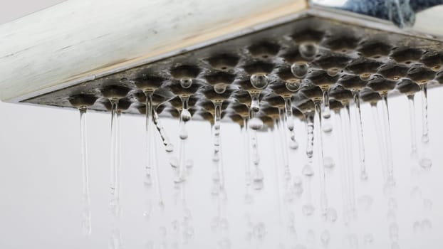 Drops of water from a shower head close up, macro photo