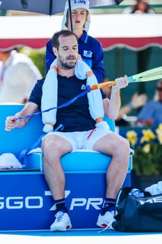 MELBOURNE, AUSTRALIA - JANUARY 12: Richard Gasquet of France at a changeover whilst playing Marc Polmans of Australia during day three of the 2024 Kooyong Classic at Kooyong on January 12, 2024 in Melbourne, Australia.