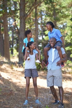 Happy, travel or black family hiking in forest to relax or bond on holiday vacation together in nature. Children siblings, mother or African father in woods trekking on outdoor adventure with smile.