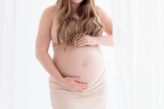 Beautiful young pregnant woman on white background banner