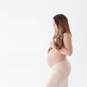 Beautiful young pregnant woman on white background banner