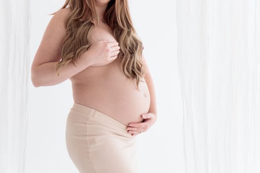 Beautiful young pregnant woman on white background banner