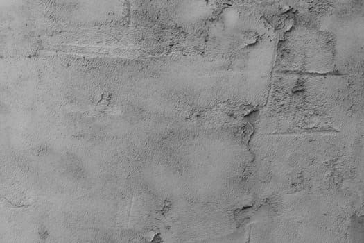 Textured grey putty. the background texture of Venetian plaster as a patterned wall.