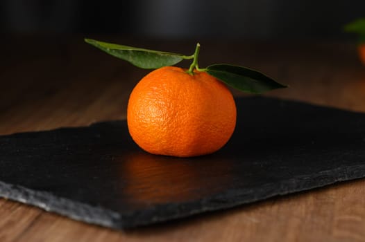 fresh juicy mandarin oranges on a wooden table