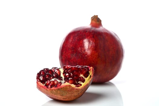 pomegranate and pomegranate slice on a white background 11