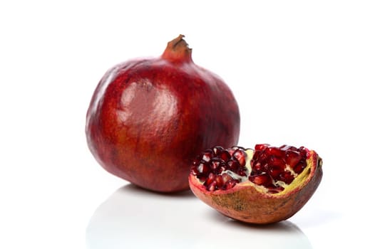 pomegranate and pomegranate slice on a white background 10