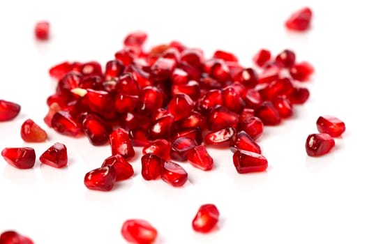 pomegranate seeds on white background