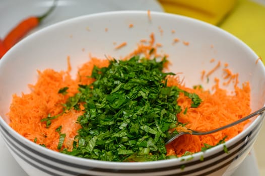 freshly grated carrots with green parsley