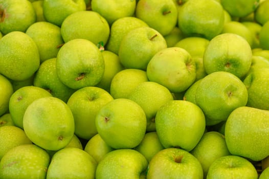 fresh appetizing green apples at the bazaar on the island of Cyprus in autumn