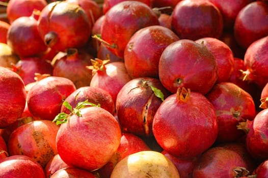 fresh appetizing pomegranates at the bazaar on the island of Cyprus in autumn