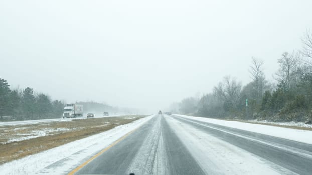 POV view through the windshield on the highway in Canada in winter