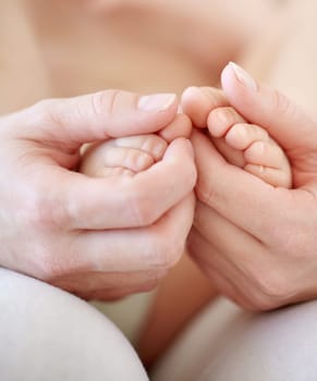 Love, mother and hands with baby or feet for development, nurture and bonding in nursery of apartment. Family, woman or newborn toes with trust, support or care for relationship or motherhood in home.