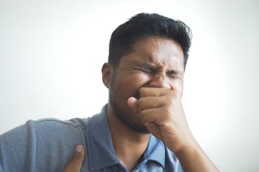 Sick man got flu allergy sneezing and blowing nose
