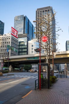 Tokyo, Japan, January 2024. the sign indicating the water intake of a hydrant on the pavement of a street in the city center