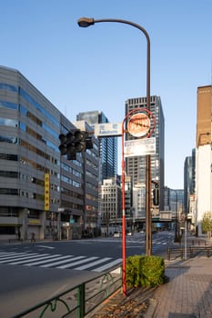 Tokyo, Japan, January 2024. the sign indicating the water intake of a hydrant on the pavement of a street in the city center