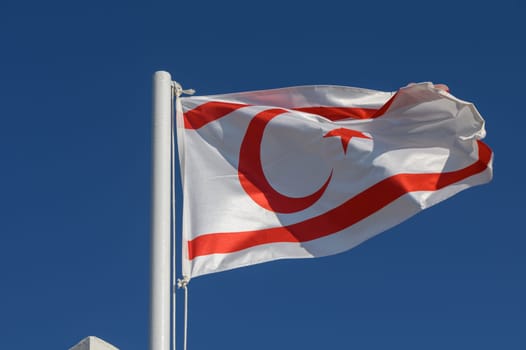 Northern Cyprus flag against blue sky 2