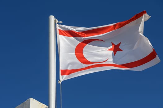 Northern Cyprus flag against blue sky 3