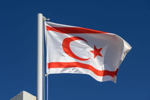 Northern Cyprus flag against blue sky 9