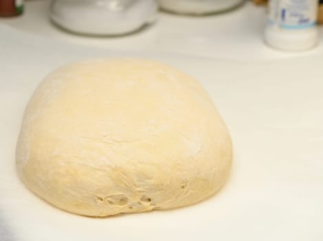 dough for homemade bread lies on the kitchen table before going into the oven 8