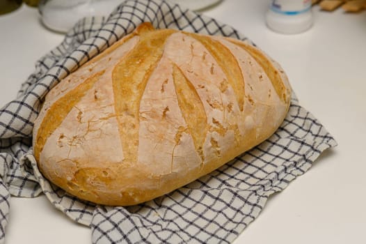 freshly baked homemade bread on the kitchen table on a light background 13