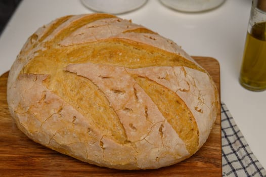 freshly baked homemade bread on the kitchen table on a light background 5