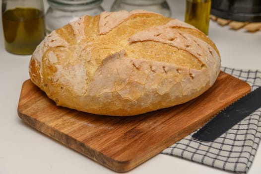 freshly baked homemade bread on the kitchen table on a light background 2