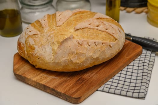 freshly baked homemade bread on the kitchen table on a light background 3