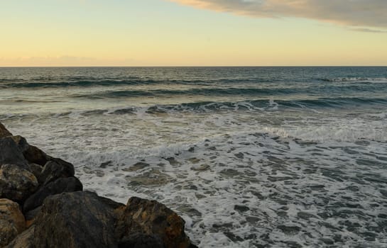 sunset on the Mediterranean Sea, beach and rocks in Northern Cyprus