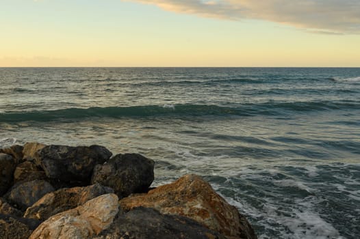 sunset on the Mediterranean Sea, beach and rocks in Northern Cyprus 1