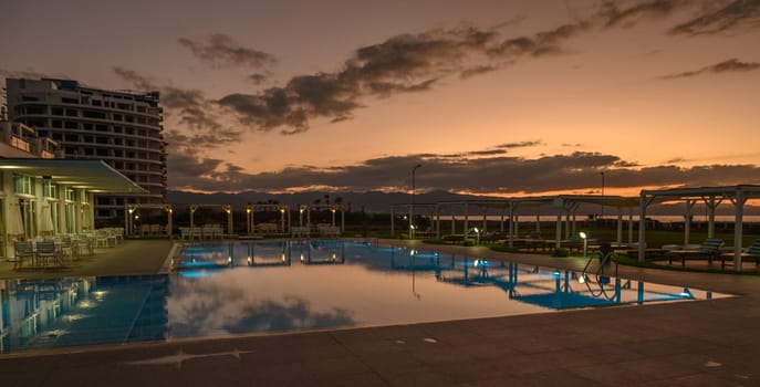 swimming pool in a residential complex in the sunset light