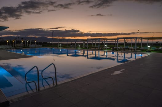 swimming pool in a residential complex in the sunset light 1