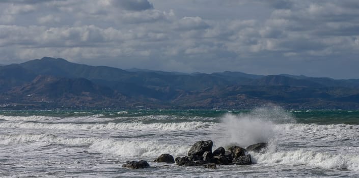 waves break on a stone in the Mediterranean Sea in autumn on the island of Cyprus 3