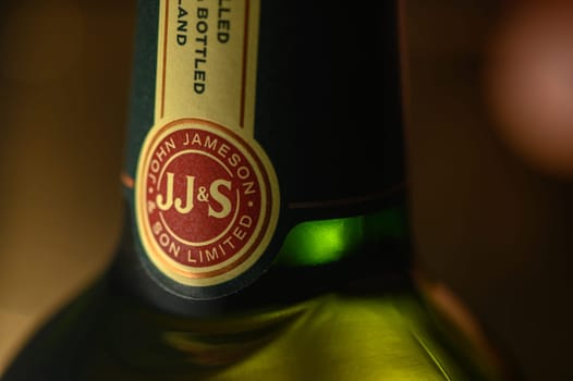 Ukraine, Chernigov 18/11/2023 - Bottle of Jameson whiskey on a background, beautiful color of whiskey