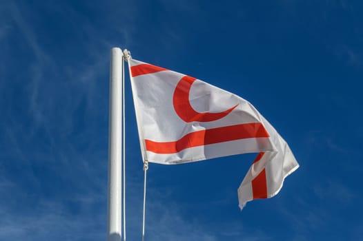 flag of the Turkish Republic of Northern Cyprus against a blue sky 1