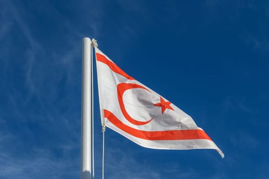 flag of the Turkish Republic of Northern Cyprus against a blue sky 3