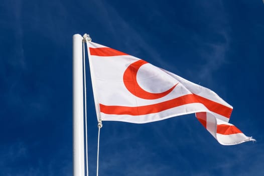 flag of the Turkish Republic of Northern Cyprus against a blue sky 4