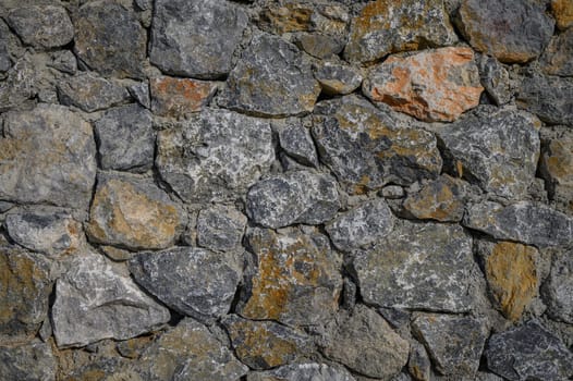 fence made of real stone in large pieces as a background 2