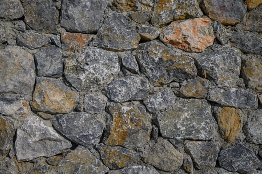 fence made of real stone in large pieces as a background